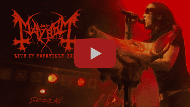 Video thumbnail of a metal vocalist performing on a red-lit stage, with 'Live in Marseille' text and a play button overlay.