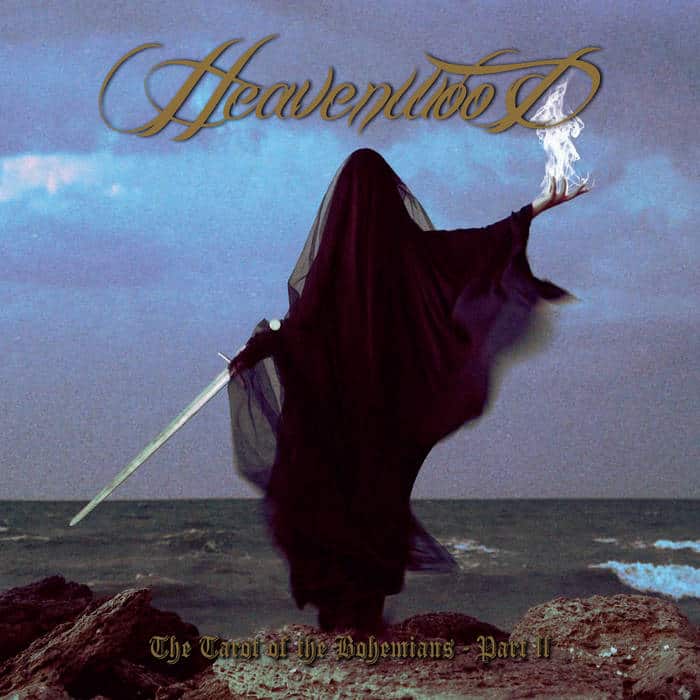 Album cover: a hooded, dark-cloaked figure stands on rocky shore wielding a glowing sword, sea in the background, with 'Heavenwood' text above.